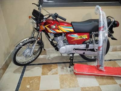 Honda CG 125 2026 Red with Genuine Atlas Honda Chrome Silencer
