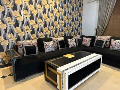 L- shaped wooden sofa with table by "Iqhlak furniture " . . .
