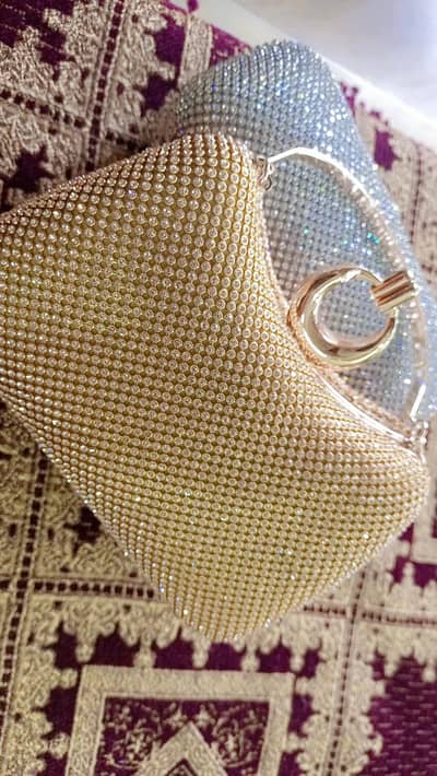 buy one get one silver and gold clutch