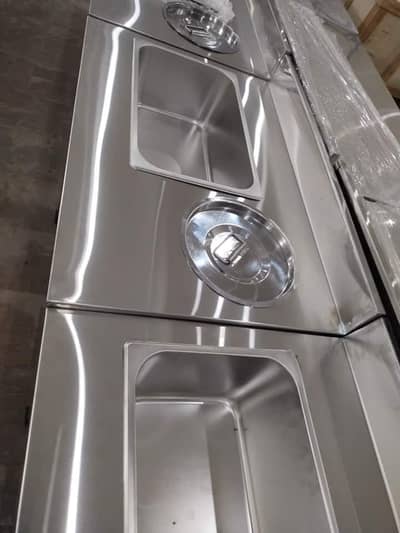 working table, pizza oven, deep fryer, hot plate, dough mixer, bags