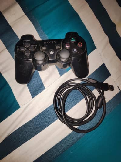 PS3 controller. Gran Turismo 5 and Naruto Shippuden 2