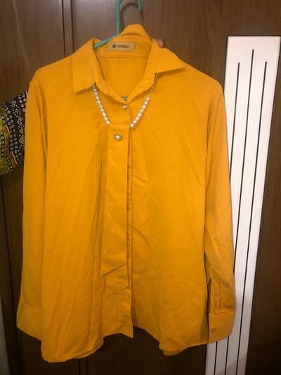 short yellow shirt with color ful skirt