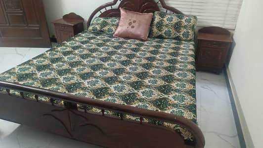 1 Wooden King Size Bed Without mattress and has 2 side table