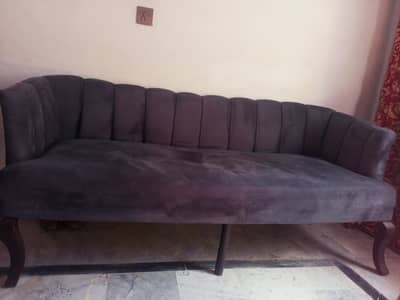 bed with sofa and coffee chairs