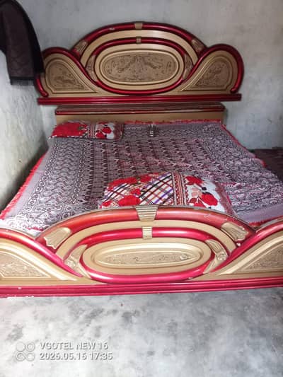 king size bed with side table and dressing table