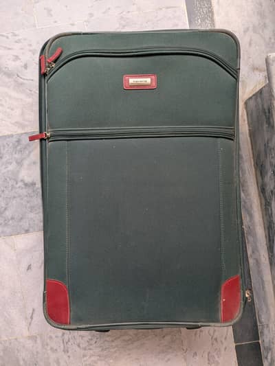 Suitcase for storing clothes or travelling