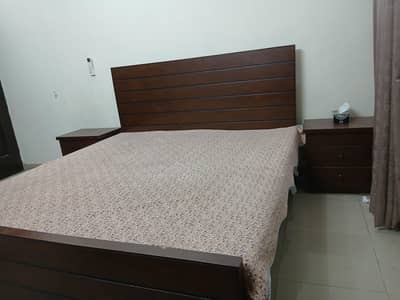 Queen sized wooden bed