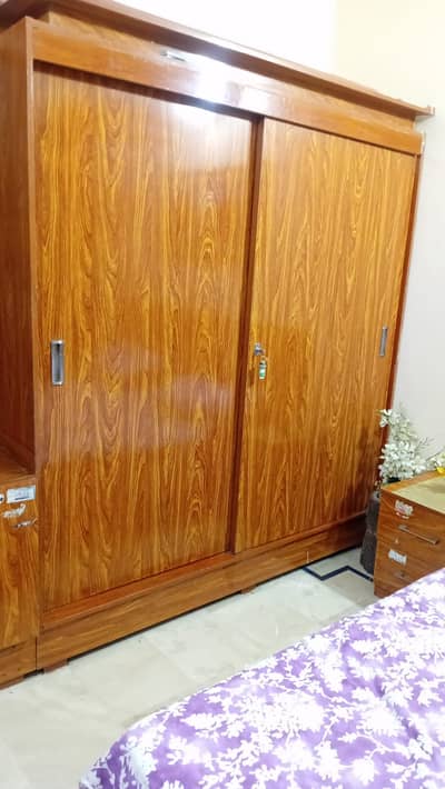 bed with side tables and cupboard