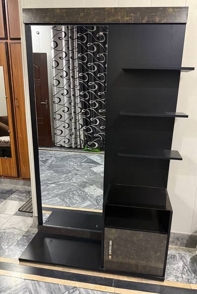 Mirror with shelf .