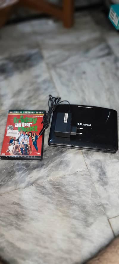 Polaroid DVD player (imported UK) PL T901B with one CD and Adapter