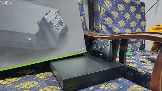 Xbox one X  1 tb  with box and 20 games installed