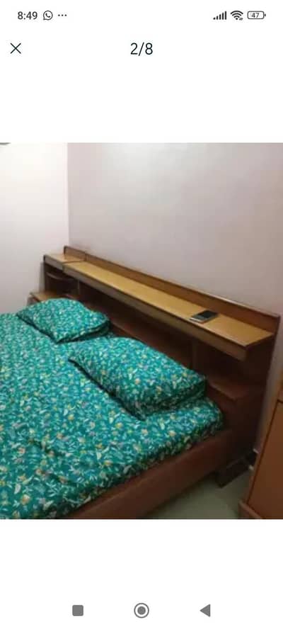 king size bed with 2 side tables and dressing table