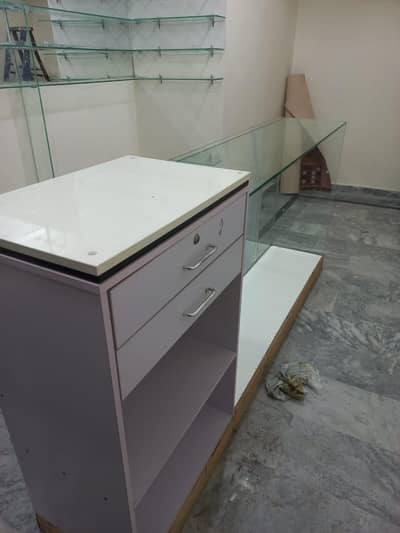 glass counter and glass wall shelves