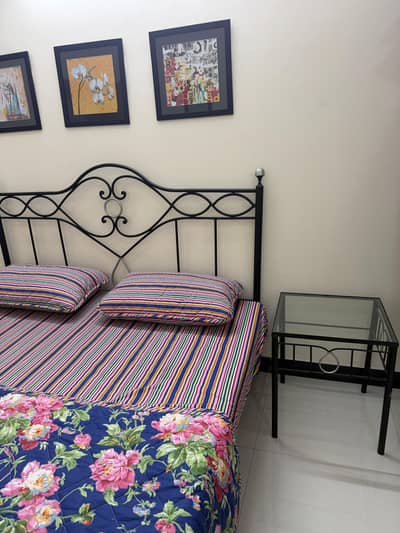 Iron bed with side tables