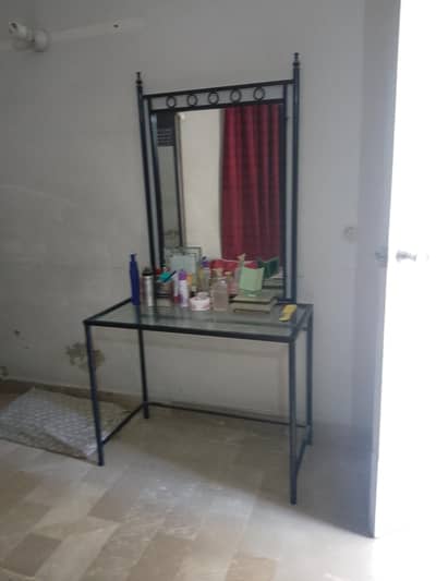 a nice dressing table with mirror a little damaged