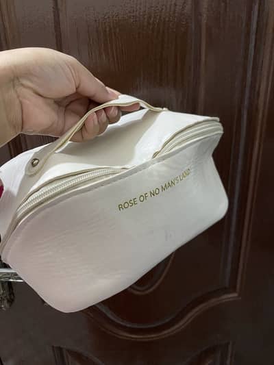 Makeup bag available in of white clr