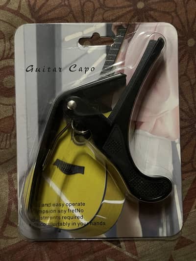 New guitar capo with pick
