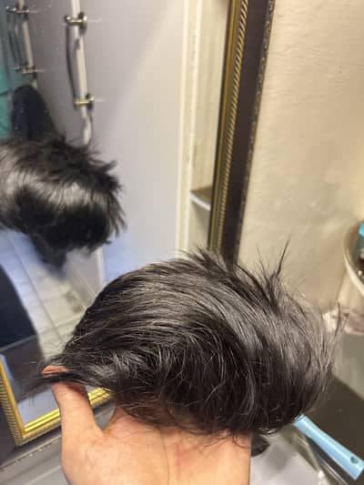 Black color hair patch for men.