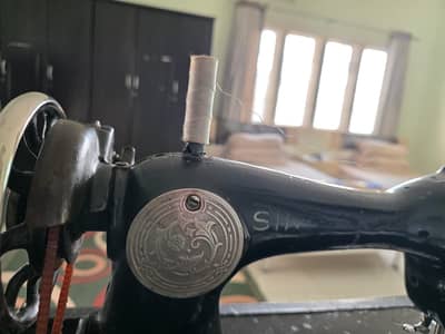 Singer sewing machine for sale.