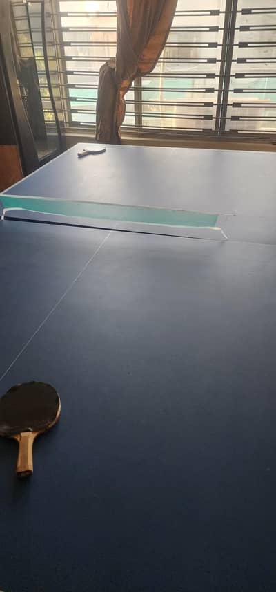 Table Tennis Table and 2 rackets.
