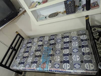 Two Single Iron Beds