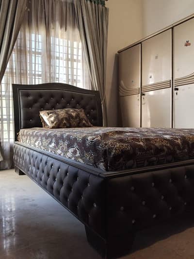 single bed with mattress.