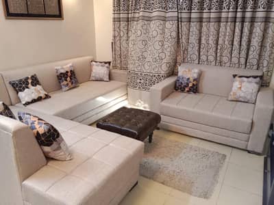 L shape 8 piece sofa set in off white is selling