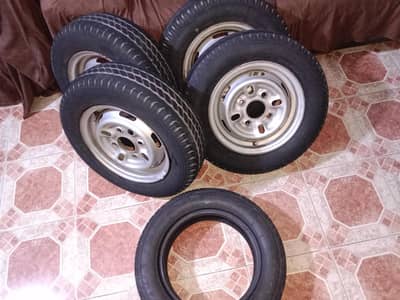 4 Tyres with rim one extra without rim 65x70 R12 condition 80 %