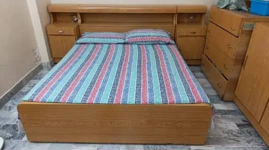 Queen Siize Bed with Side Tables and attached storage box in bed