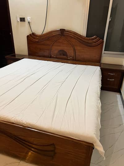 King Size Bed with bedside tables and a mattress.