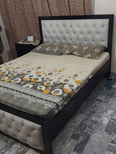 wooden bed with draw