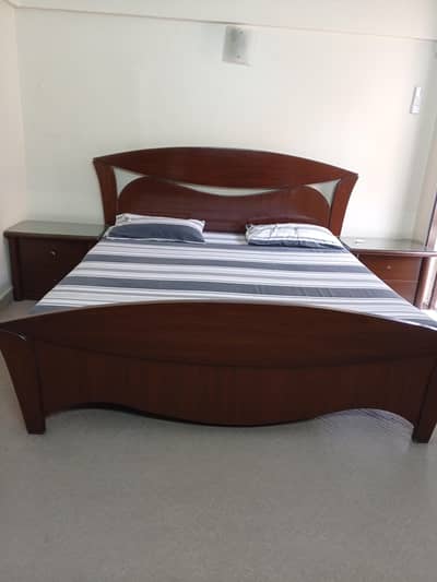 King size bed with large mirror and chest drawer