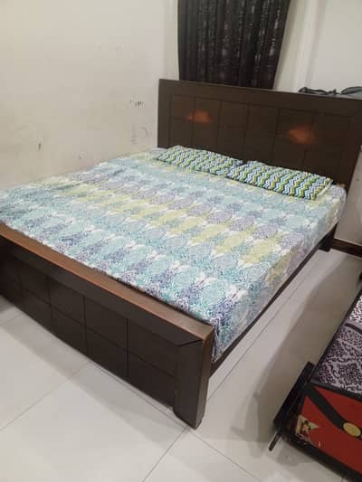double bed with side tables and dressing table