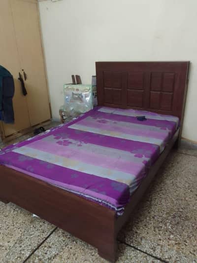 wooden bed with metress