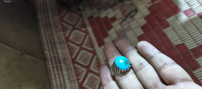 torquish stone gold crafted in silver ring