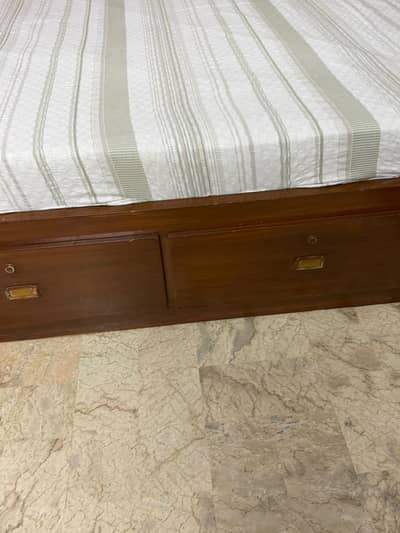 Slightly used king size bed with storage box and side tables