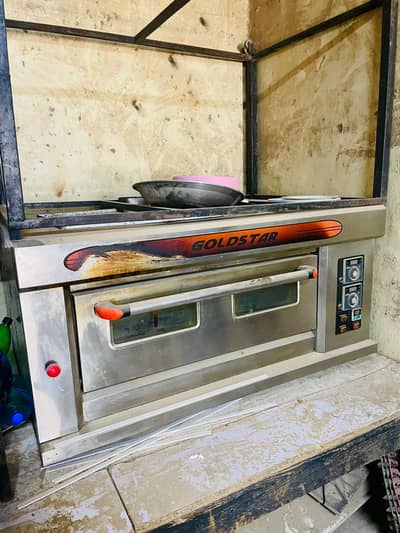 gold Star pizza oven with 14 pan large 14 pan medium and 14 pan small