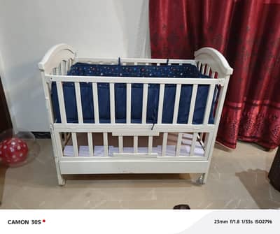 Baby cot, crib.