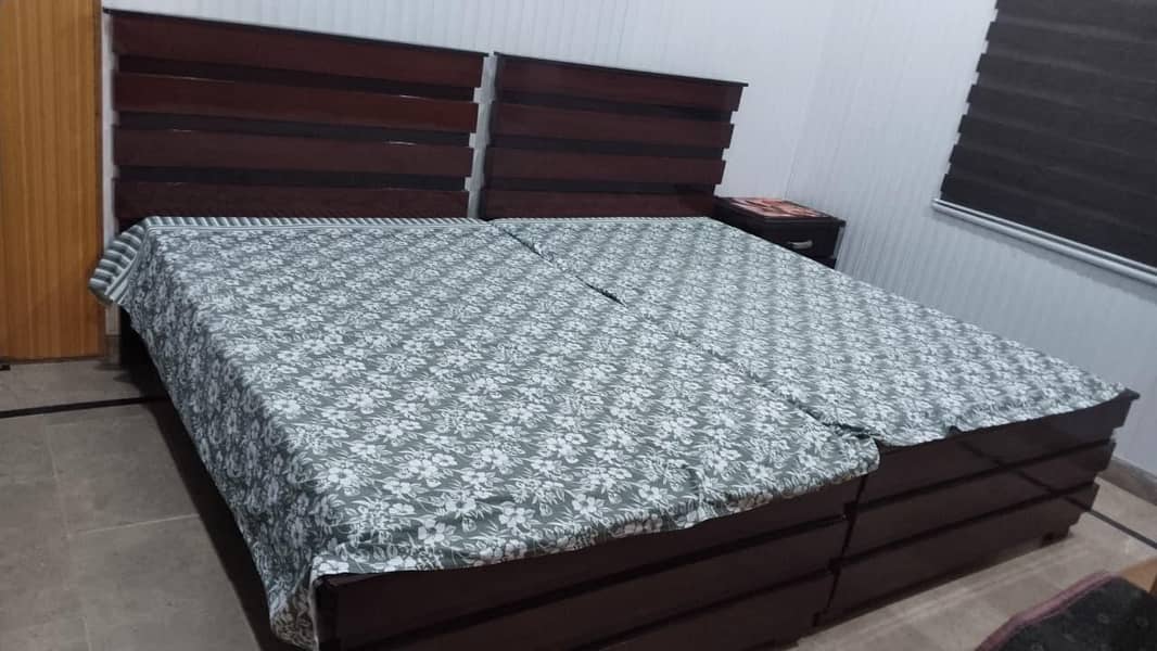 Two single bed set and one side table 1