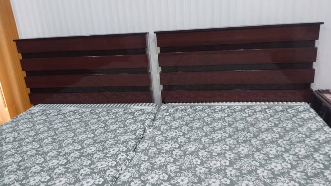 Two single bed set and one side table 3