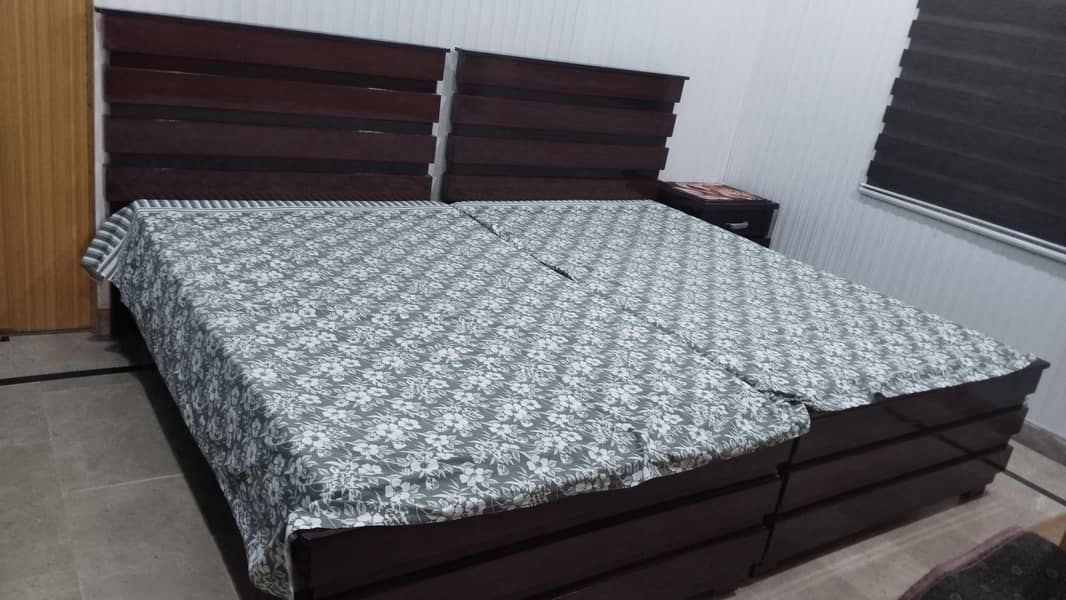 Two single bed set and one side table 4