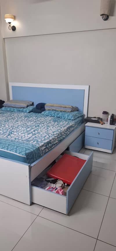 bed with extra luggage drawers