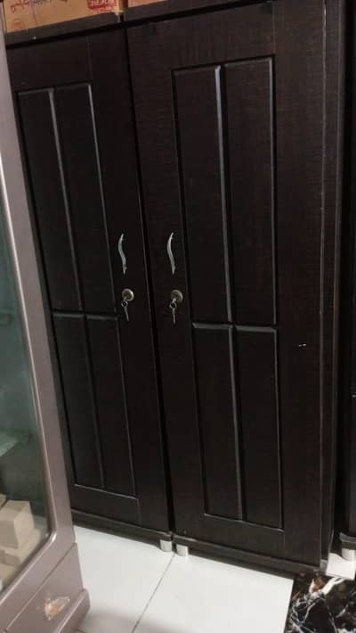 2 door wooden cupboard  and a wooden divider. .