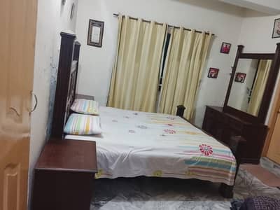 bed and dressing table and side tables