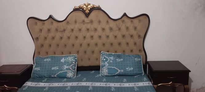 Slightly used bed with two side tables