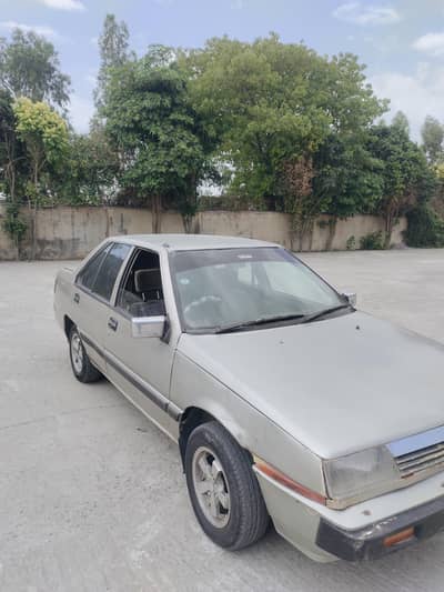 Mitsubishi lancer 86 model contact no 03003858348
