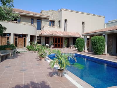 Luxurious 2000 Yards Bungalow with Pool Prime Phase VI Near Khyaban-e-Hafiz!