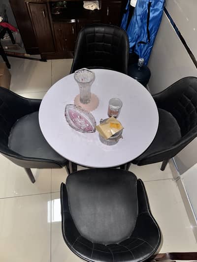 4 chairs and a table set