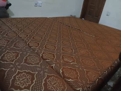 Brown sofa cum bed.