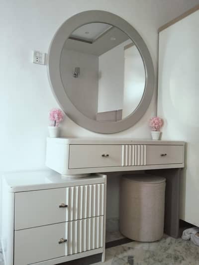 elegant dresser with round mirror
